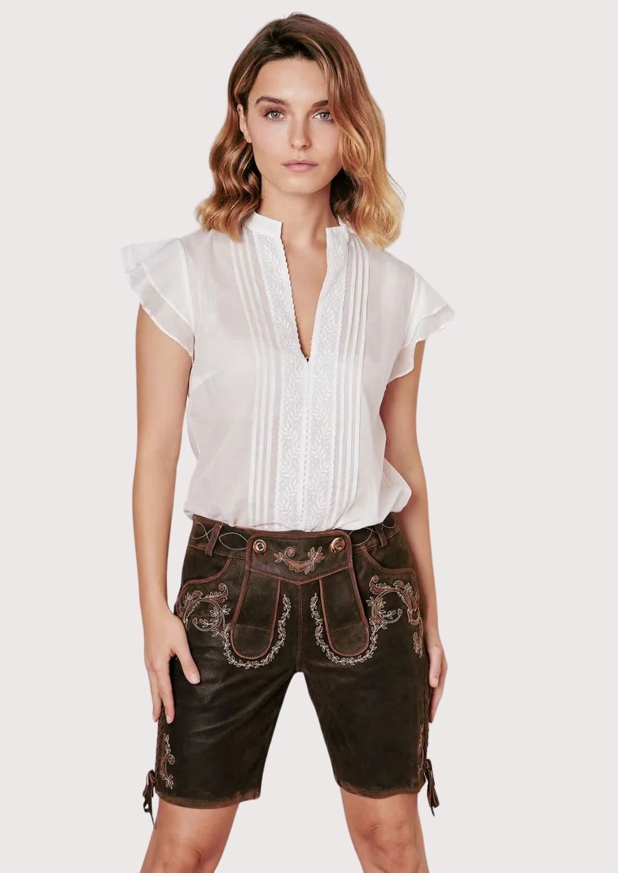 Sleek women’s lederhosen with intricate floral embroidery, perfect for Oktoberfest and cultural events.