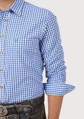Stylish men’s blue checked shirt with rolled sleeves