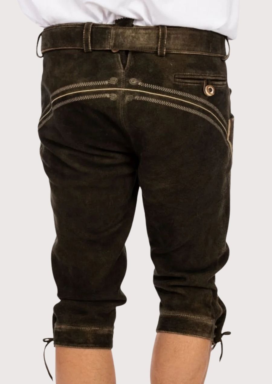 Timeless men’s Bundhosen made from soft suede leather, featuring floral embroidery and adjustable cuffs, ideal for outdoor gatherings and beer festivals.