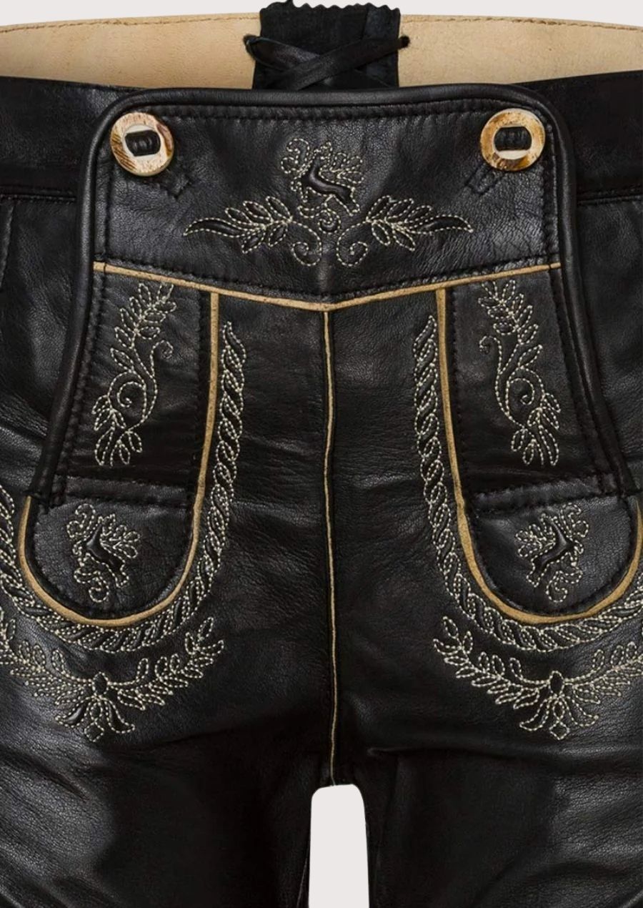 Traditional Bavarian women’s lederhosen with floral detailing and adjustable buttons, perfect for Oktoberfest, beer festivals, and cultural celebrations.