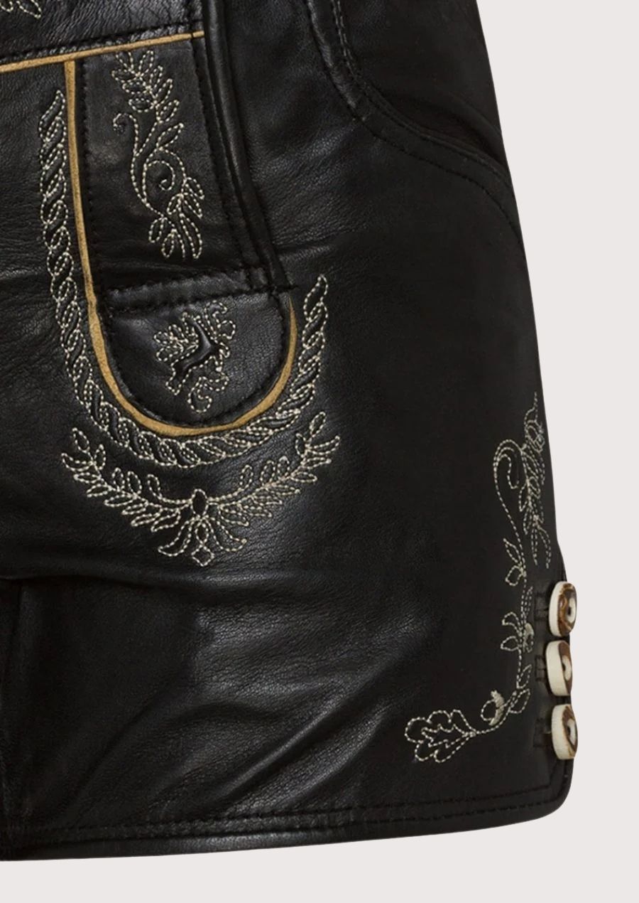 High-quality leather lederhosen for women with delicate embroidery and a flattering adjustable fit, perfect for Oktoberfest, weddings, and traditional festivals.