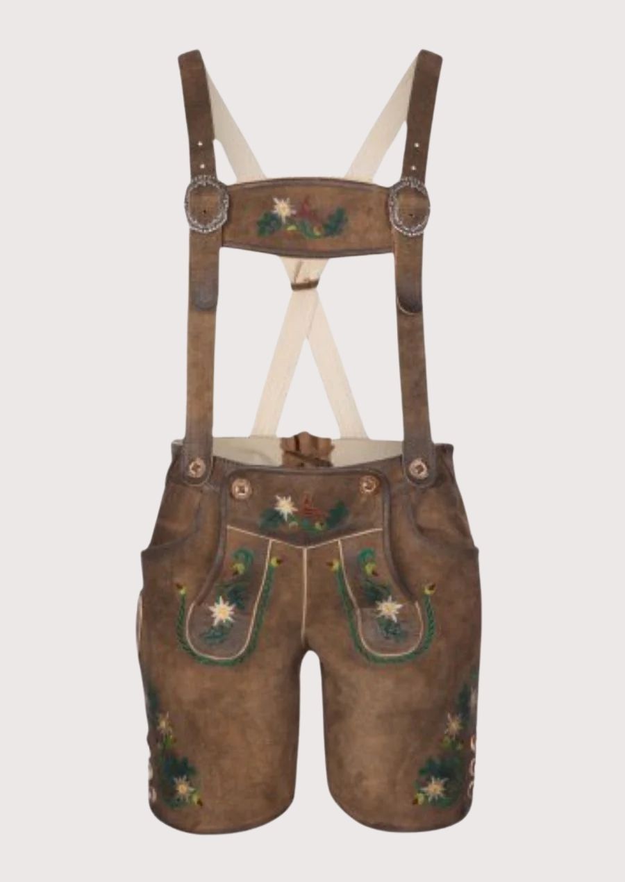 Suede Lederhosen Tan Edelweiss Bib featuring embroidered suspenders, Edelweiss artwork, and Alpine heritage styling.