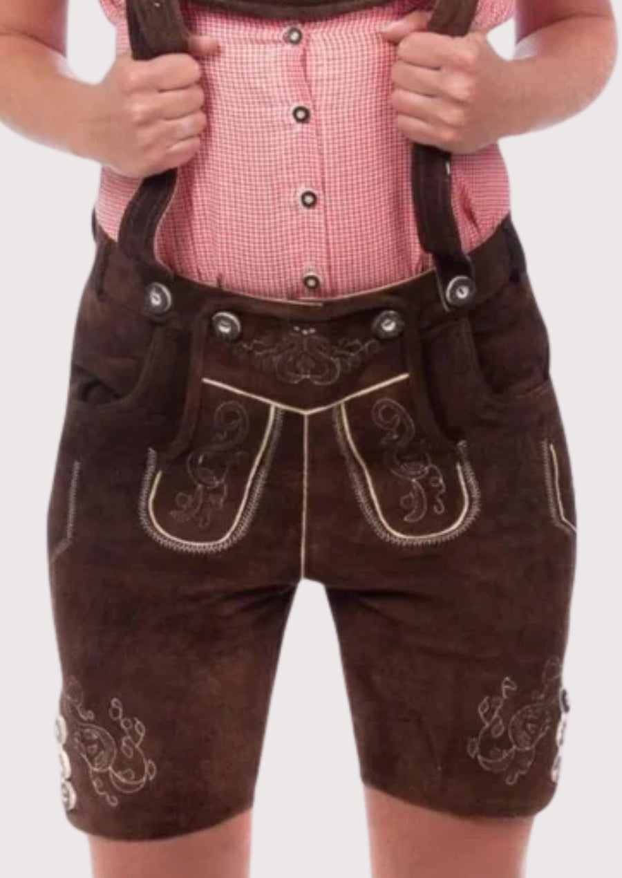 Authentic Bavarian women's leather shorts in dark brown suede with embroidered accents, suspenders, and Alpine styling.