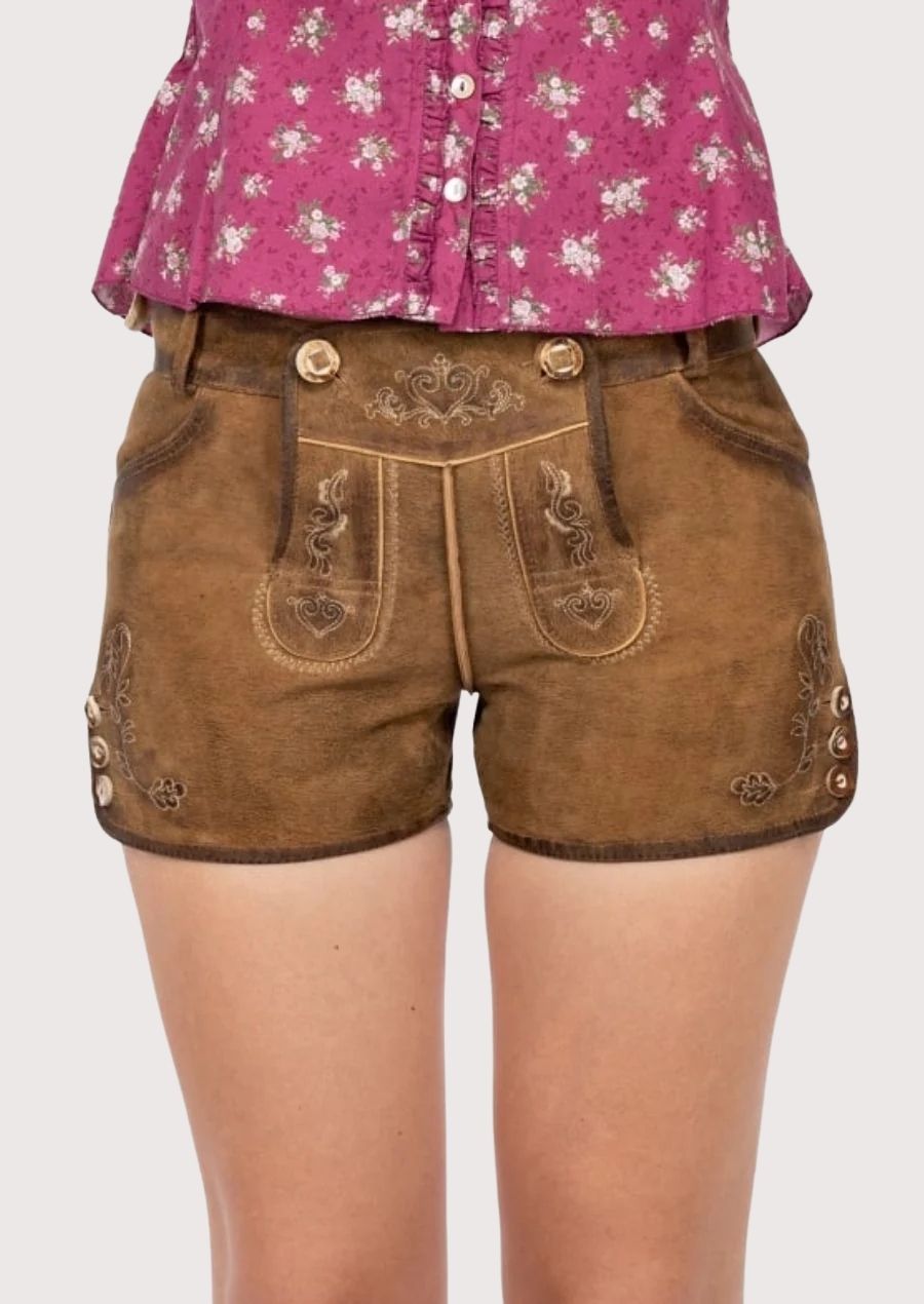 Tan Suede Floral Lederhosen Women showcasing elegant embroidery, decorative buttons, and timeless Oktoberfest appeal.