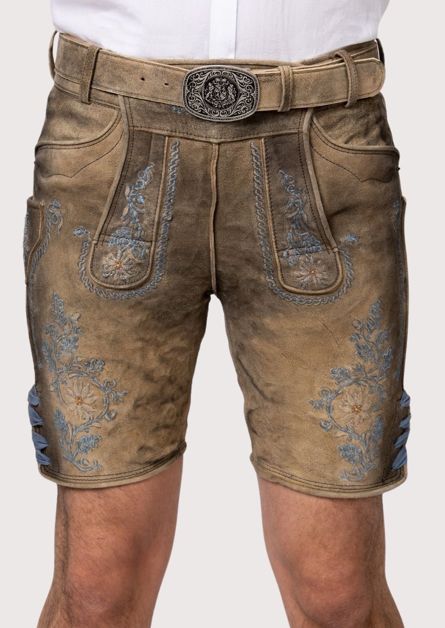 Brown leather shorts with floral embroidery and belt on a plain background