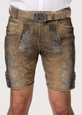 Brown leather shorts with floral embroidery and belt on a plain background