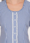 Classic women’s Dirndl blouse featuring a ruffled neckline and intricate lace details, perfect for cultural celebrations.