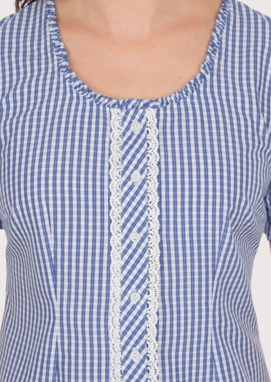 Classic women’s Dirndl blouse featuring a ruffled neckline and intricate lace details, perfect for cultural celebrations.