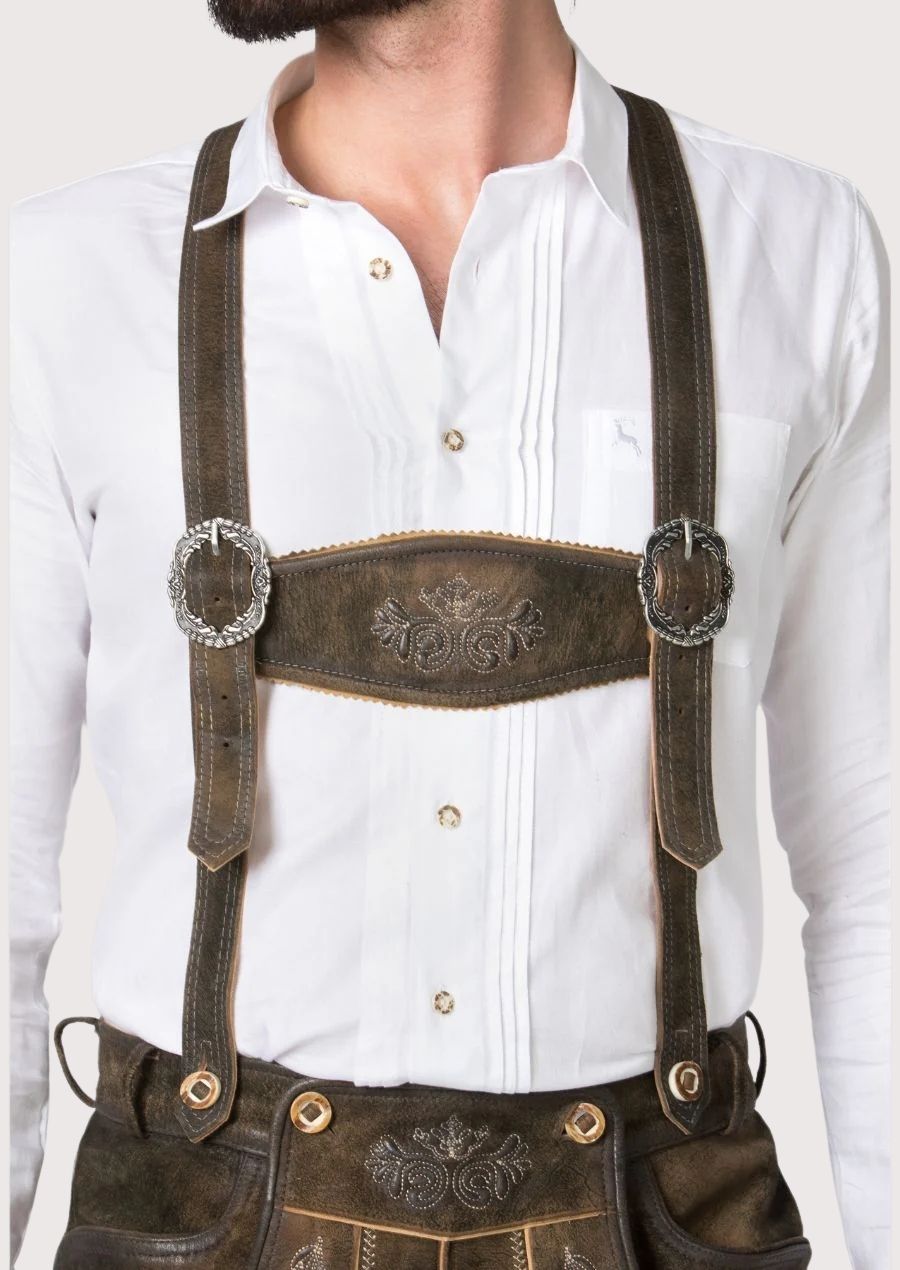 Traditional Bavarian Bundhosen in rustic suede leather with detailed embroidery and authentic Alpine craftsmanship