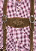 Traditional Bavarian Bundhosen leather pants featuring decorative embroidery, knee-length design, and suspenders