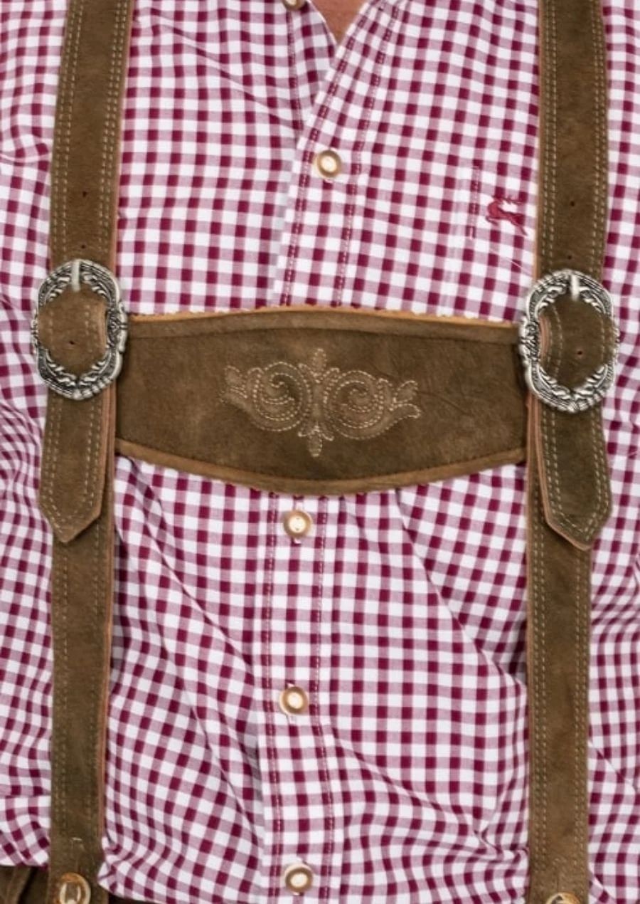 Traditional Bavarian Bundhosen leather pants featuring decorative embroidery, knee-length design, and suspenders