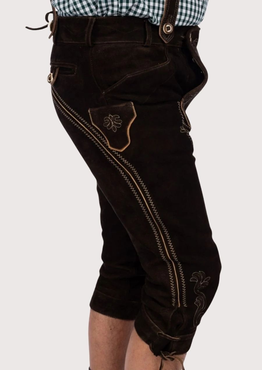 Traditional Bavarian leather trousers featuring embroidered braces, ornate detailing, and authentic Alpine craftsmanship