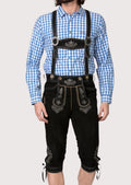 Traditional Bavarian black lederhosen outfit featuring embroidered braces, decorative detailing, and authentic craftsmanship