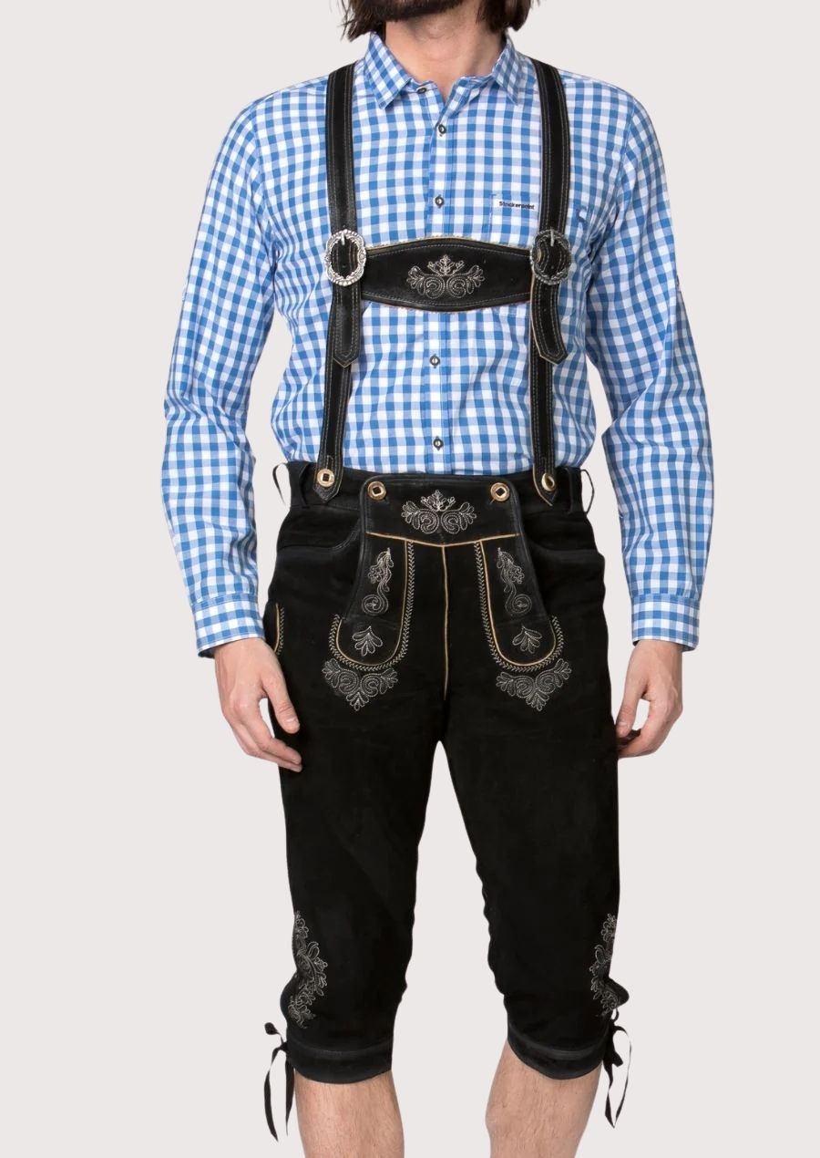 Traditional Bavarian black lederhosen outfit featuring embroidered braces, decorative detailing, and authentic craftsmanship