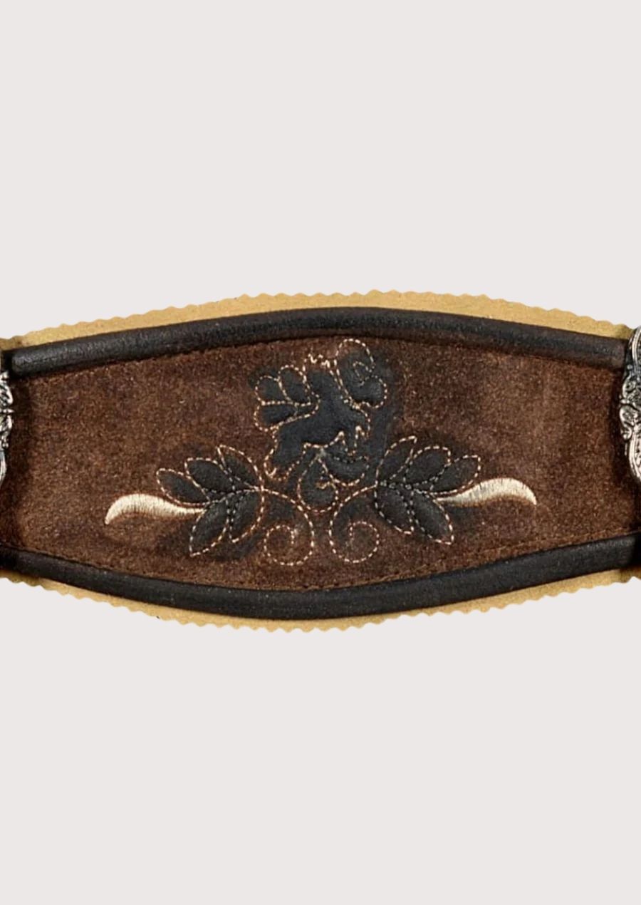 Rustic brown leather lederhosen featuring deer embroidery, decorative suspenders, and heritage craftsmanship
