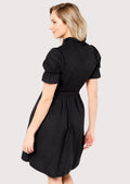 Traditional Alpine Dirndl dress in black with a structured bodice, ribbon waist tie, puff sleeves, and timeless Bavarian craftsmanship.