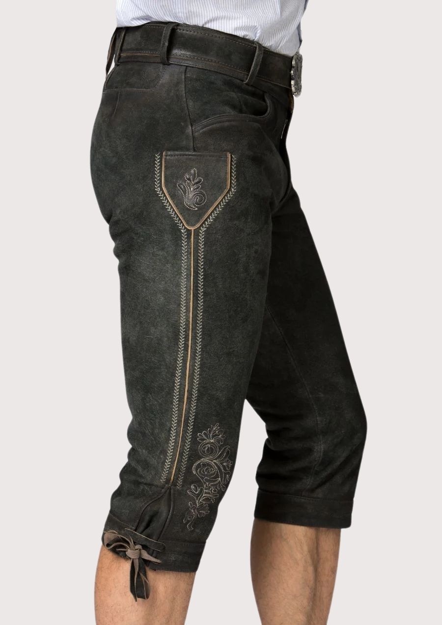 Traditional black Bavarian Bundhosen with rustic finish, decorative side embroidery, and authentic Alpine craftsmanship
