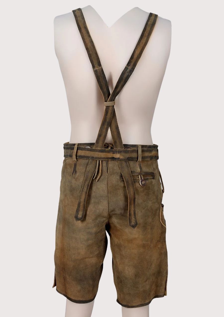 Traditional brown lederhosen made from premium goatskin suede with ornate embroidery and adjustable suspenders