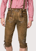 Traditional Bundhosen with suspenders for men featuring decorative embroidery and authentic Alpine craftsmanship