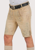 Bavarian cream suede lederhosen showcasing embroidered deer accents and decorative folk art patterns