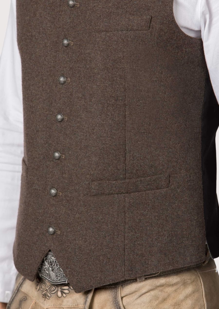 Traditional German brown waistcoat paired with embroidered lederhosen