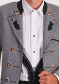 Elegant men's Bavarian jacket in grey wool with embroidered accents and modern fit, designed for weddings and cultural festivals.

