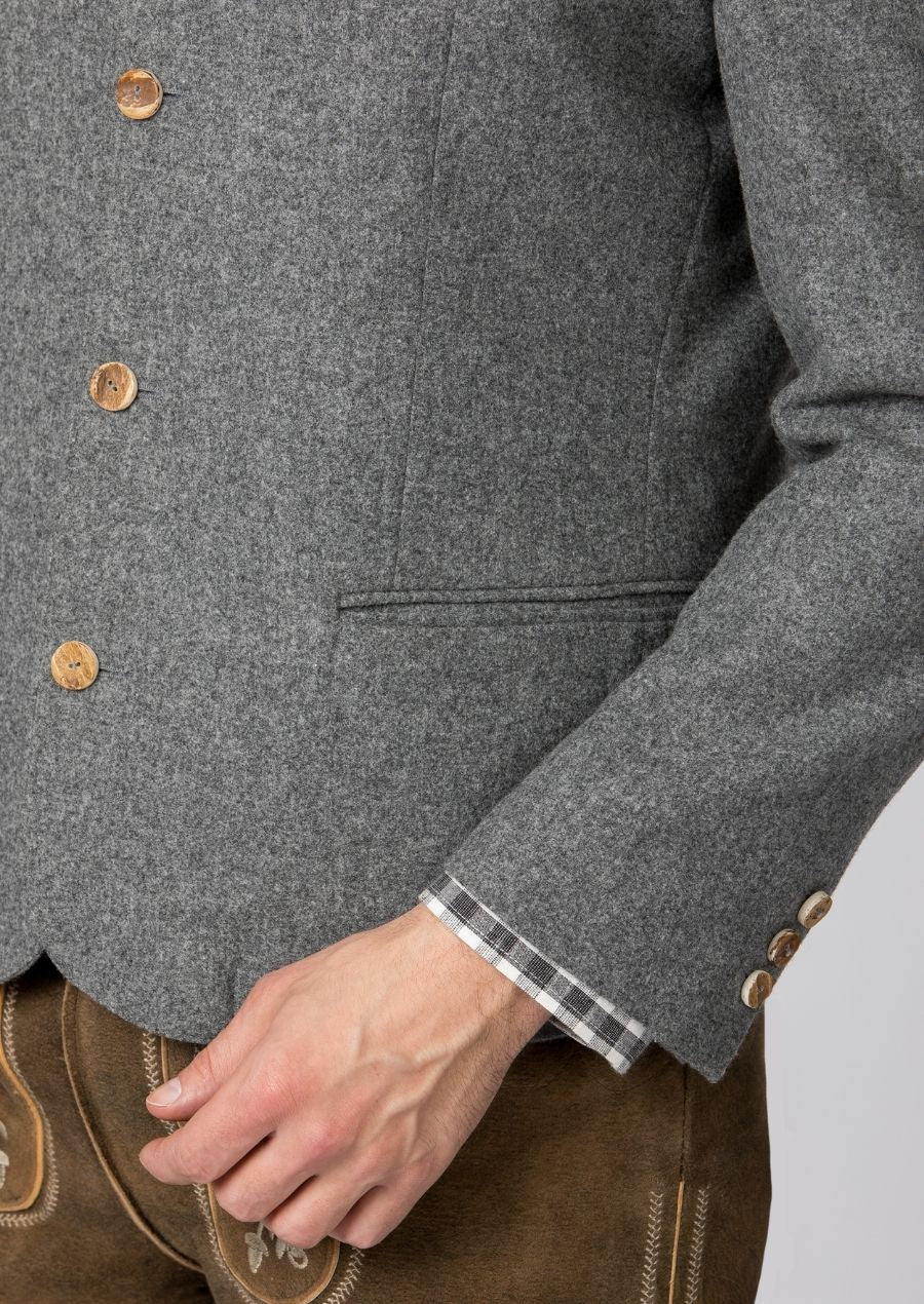 Traditional men’s trachten jacket in grey wool with chest pocket.