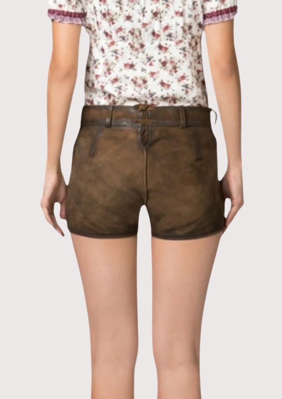 Vintage Bavarian lederhosen for women featuring decorative embroidery, horn-style buttons, and authentic Alpine styling.