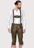 Vintage brown goatskin suede Bundhosen featuring elegant embroidery, decorative front flap, and traditional Bavarian styling