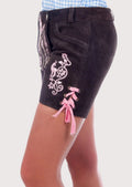 Women's Alpine outfit featuring black embroidered lederhosen shorts, blue gingham blouse, and traditional neck scarf.