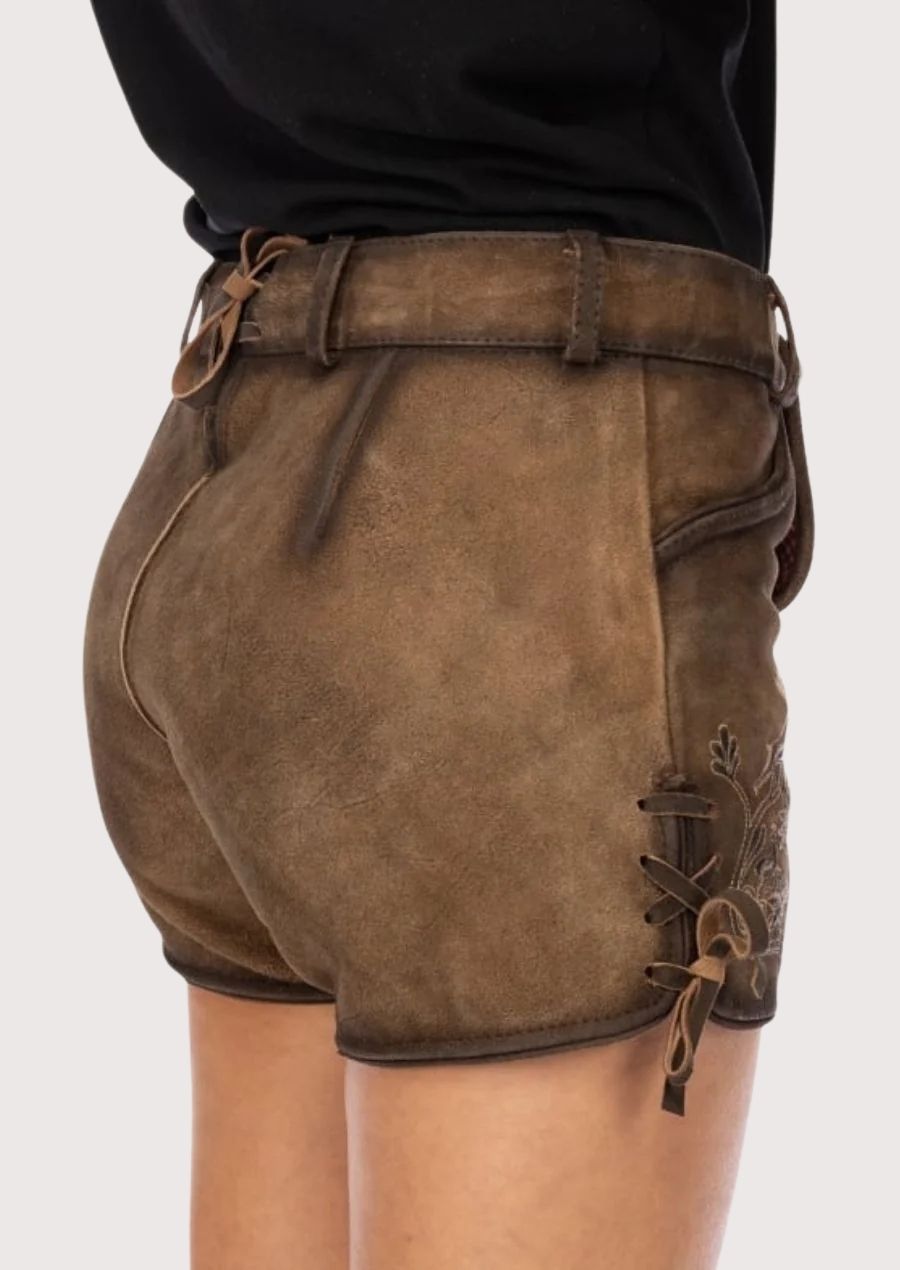 Women's Alpine suede festival shorts crafted from distressed leather with decorative embroidery and folk-inspired details.