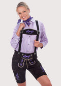 Women's Alpine lederhosen style with embroidered suspenders, decorative purple motifs, and heritage-inspired design.