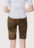 Women's Bavarian leather shorts showcasing embroidered floral motifs, horn-style buttons, and Alpine craftsmanship.