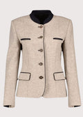 Women's beige wool Trachten jacket with navy trim, stand-up collar, decorative horn-style buttons, tailored Bavarian jacket, authentic German Alpine fashion.