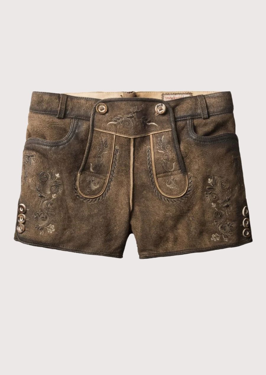Close-up of women’s brown lederhosen shorts featuring detailed alpine embroidery