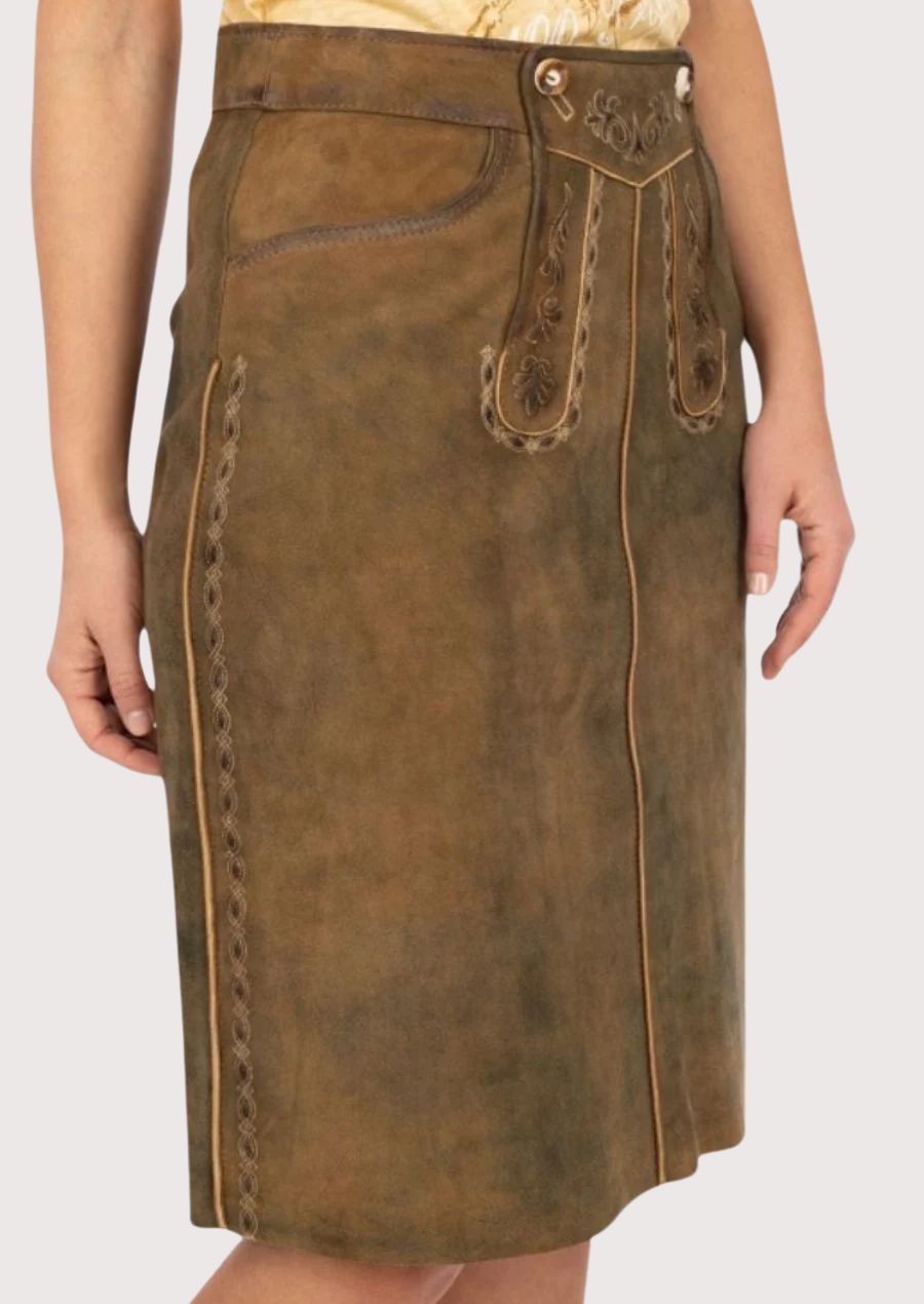Woman wearing brown suede leather skirt with traditional design