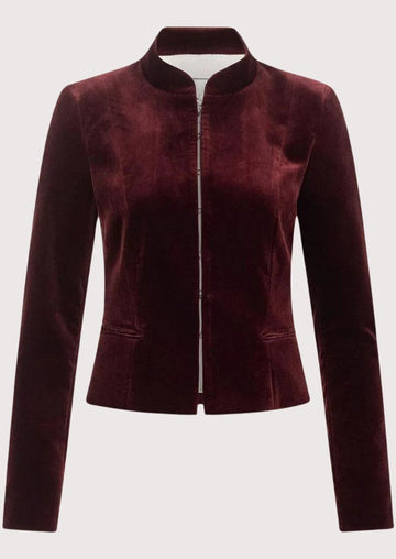 Women's burgundy velvet Trachten jacket with stand-up collar, tailored fit, concealed front closure, premium Bavarian Alpine jacket, authentic German heritage fashion.