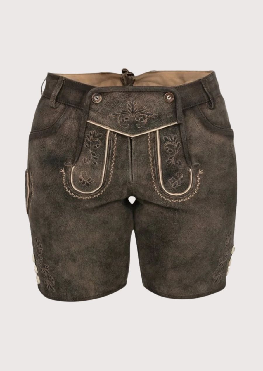 Front view of women’s dark brown lederhosen shorts with traditional embroidered flap