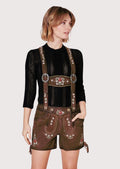 Women's floral Alpine lederhosen outfit showcasing embroidered suspenders, decorative rose motifs, and heritage styling.