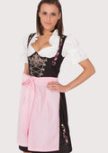 Women's floral embroidered Oktoberfest Dirndl with a fitted lace-up corset, pastel pink apron, black skirt, and classic German Alpine design.