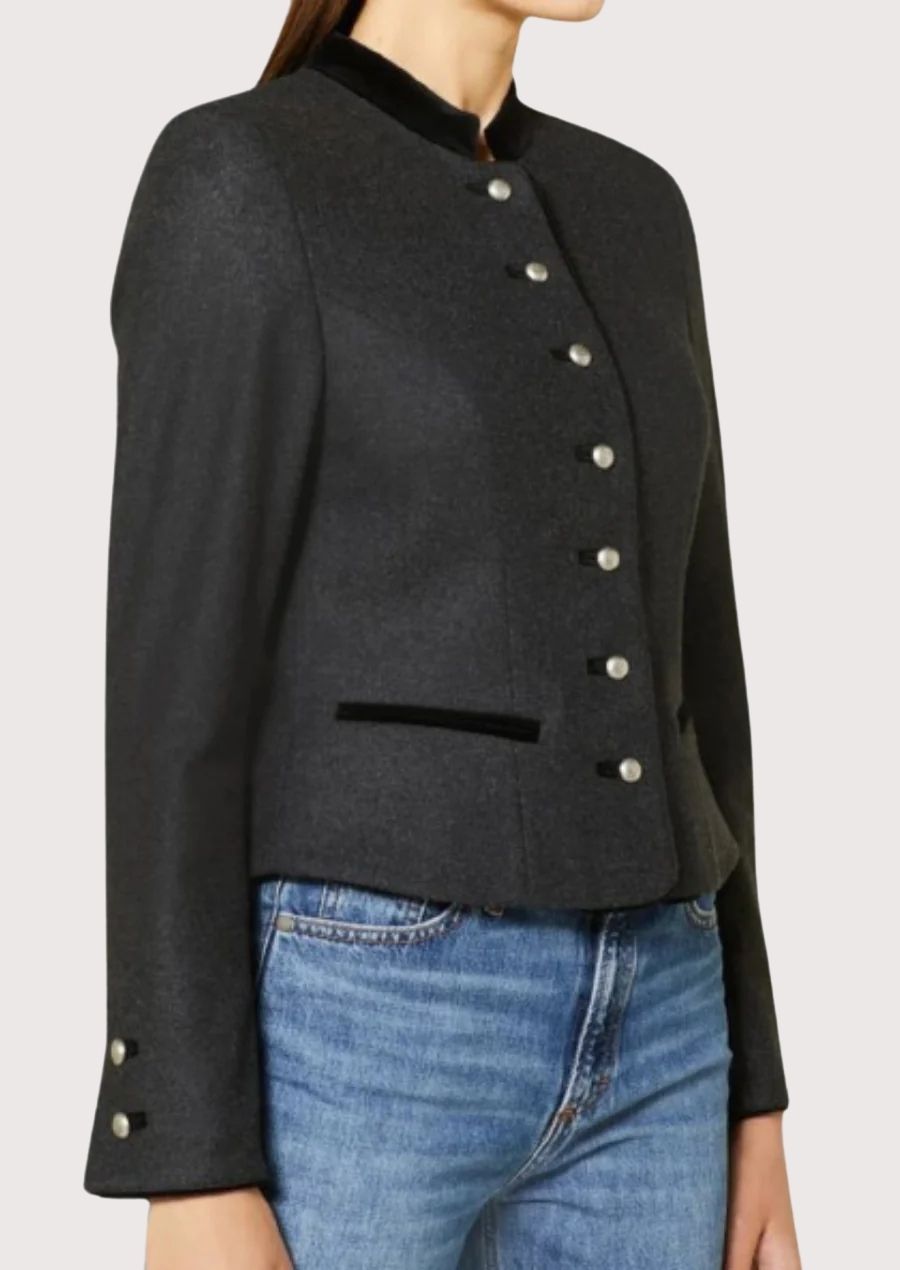 Elegant women's Alpine heritage jacket in charcoal wool with velvet trim, stand collar, and traditional Trachten craftsmanship.
