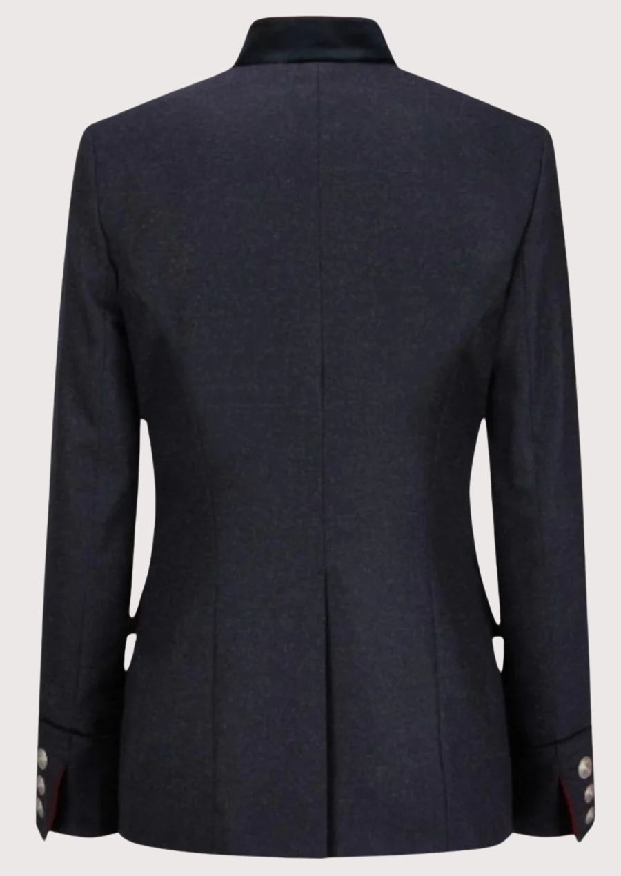Women’s navy alpine jacket with red inner collar and silver buttons.