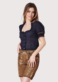 Women's tan suede lederhosen featuring elegant floral embroidery, knee-length styling, and authentic Bavarian craftsmanship.